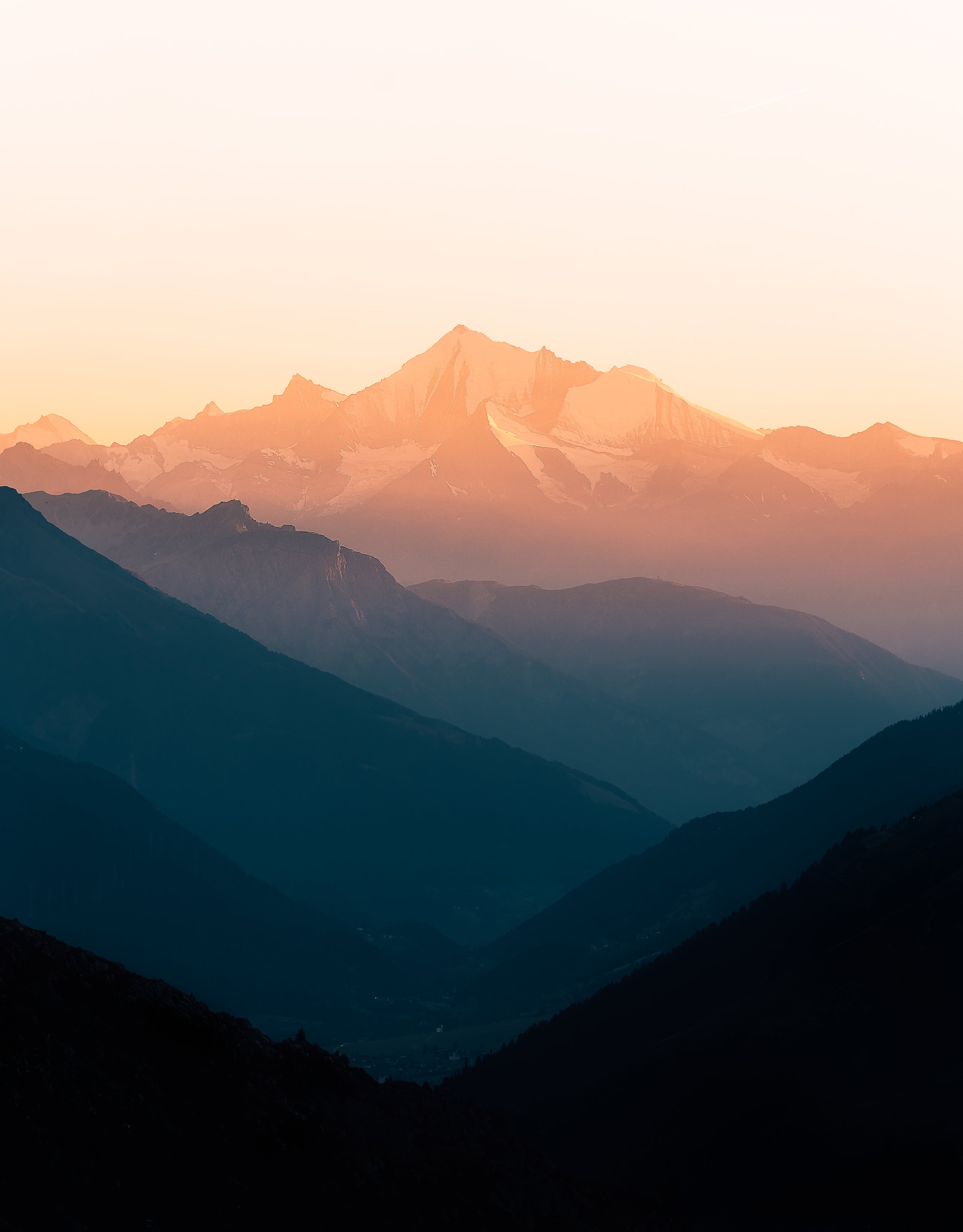 Misty mountain ranges at sunrise